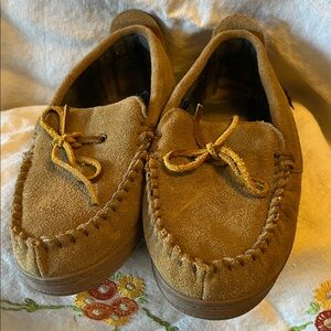 Unworn leather moccasins with rubber soles